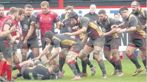  ?? Picture: LIZ BRYAN ?? ● RGC forwards come to the aid of captain Meredydd Francis (on ground) at Aberavon.