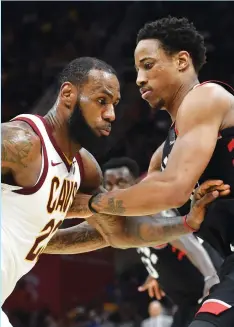  ?? (Reuters) ?? LEBRON JAMES (left) and DeMar DeRozan (right) were two of the biggest names to switch teams this summer, both going from the Eastern Conference to the Western Conference.