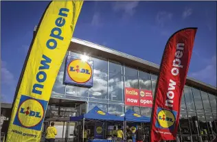  ?? CHET STRANGE / GETTY IMAGES ?? One of Lidl’s first U.S. grocery stores awaits customers on June 18 in Virginia Beach, Virginia. The German-based grocery chain is opening stores across the country.