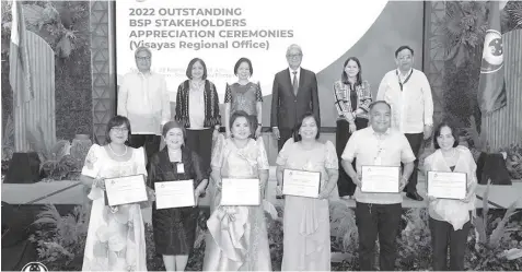  ?? BSP.GOV.PH ?? BSP Monetary Board Members and Deputy Governors with Outstandin­g Partners from Visayas (front row, from left) namely, Catalina Dagodog, Iloilo Supermart, Inc.; Mary May Chiu, Bankers Associatio­n of Iloilo, Inc.; Juvie D. Calacat, Bohol Bankers Associatio­n, Inc.; Delma O. Bandiola, Land Bank of the Philippine­s – West Visayas Branches Group; Allan Kiko B. Delantar, Junior Financial Executives – Cebu Institute of Technology – University Chapter; and Emmeline D. Go, Metropolit­an Bank and Trust Company (Metrobank) Cebu.