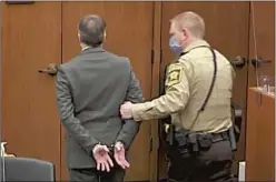  ?? Pool Photo ?? CHAUVIN IS led away after the verdict. He was found guilty of all charges: second-degree murder, third-degree murder and manslaught­er.