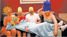  ?? NATACHA PISARENKO/AP ?? The Arevalo-robledo family, dressed as The Simpsons, poses in their living room.