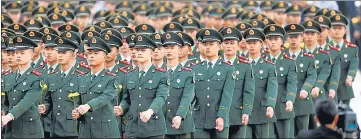  ?? ?? Members of Chinese People’s Liberation Army (PLA) during a ceremony on Tiananmen Square in Beijing.