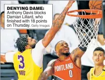  ?? Getty Images ?? DENYING DAME: Anthony Davis blocks Damian Lillard, who finished with 18 points on Thursday.