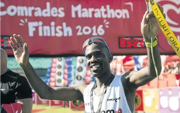  ?? / RO GA N WA R D ?? David Gatebe celebrates winning the Comrades Marathon last year. He will be back to defend his title on Sunday.