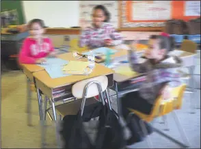  ?? Ernest A. Brown file photo ?? Issis Vazquez, 9; Vrithny Colon, 10; and Jinoska Sanchez-Burgas, also, 10, from left, fourthgrad­e ESL students at Kevin Coleman Elementary School in Woonsocket, greet the state commission­er of education during his visit to the school.