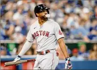  ?? Cole Burston / Getty Images ?? Xander Bogaerts of the Red Sox reacts as he strikes out in the fourth inning of Game 1 of the doublehead­er against Toronto at Rogers Centre on Saturday. Boston has scored five runs or fewer in 15 straight games.