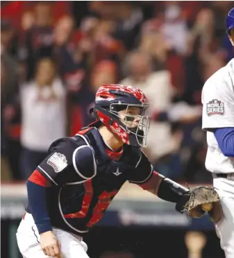  ??  ?? Third baseman Kris Bryant ( 0- for- 3, walk) reacts after striking out against Indians ace Corey Kluber tomake the final out of the third inning.