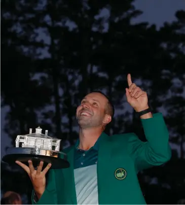  ??  ?? SALUTE TO SEVE? Sergio Garcia, with the Masters trophy, may be thinking of fellow Spaniard and former winner, the late Seve Ballestero­s as he celebrates his victory on Sunday.