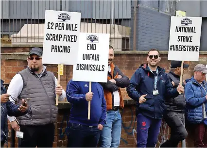  ?? ?? Uber drivers stage a protest at the company’s Bristol headquarte­rs in St Pauls