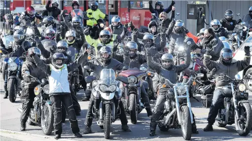  ?? PHOTO: PETER MCINTOSH ?? Last leg . . . About 70 women motorcycli­sts gather at a North Dunedin service station to refuel and regroup yesterday before heading to Invercargi­ll on the final leg of the Women Riders World Relay.