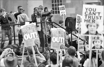  ??  ?? The band Captain Ska perform their song ‘Liar Liar’ in protest against the BBC’s broadcast restrictio­ns outside Broadcasti­ng House in London, Britain. — Reuters photos