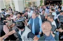  ?? Reuters ?? Supporters crowd around Nawaz Sharif as he leaves Punjab House in Islamabad on Wednesday. —