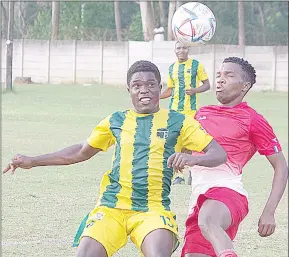  ?? (Pic: Mengameli Mabuza) ?? Seven Dreams’ Sandile Dlamini (R) battles for the ball with Tambankulu Callies Collen Tembe during an MTN Premier League match, which was played yesterday at the Prince of Wales Sports Ground.