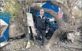  ?? Francine Orr Los Angeles Times ?? MAYOR Eric Garcetti tours homeless camps around the Sepulveda Basin in 2016. Public anger is rising over why L.A. hasn’t made more headway against the crisis.