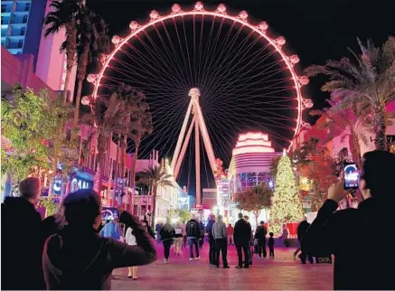  ?? Photograph­s by Wally Skalij Los Angeles Times ?? A NEW SHOW at the Linq Promenade creates a visual and aural feast, with music and lights giving the surroundin­gs a boost.