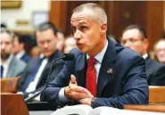  ?? AP PHOTO/JACQUELYN MARTIN ?? Corey Lewandowsk­i, former campaign manager for President Donald Trump, references a copy of the Mueller Report as he testifies to the House Judiciary Committee on Tuesday in Washington.