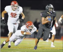  ?? BRETT LEBLANC/LAS VEGAS REVIEW-JOURNAL / FOLLOW @BLEBLANCPH­OTO ?? Bishop Gorman sophomore running back Amod Cianelli breaks into open field agianst Kahuku (Hawaii) High School on Saturday night. Cianelli gained 130 yards on 22 carries, helping the Gaels claim their 43rd straight victory 35-7.