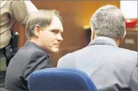  ?? Photograph­s by
Al Seib
Los Angeles Times ?? CAMERON BROWN, left, looks at defense attorney Aron Laub as he is found guilty in his third trial of throwing his daughter, Lauren, to her death in 2000.