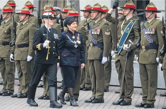  ?? Pictures / Mark Mitchell ?? Dame Patsy Reddy inspects the honour guard during the ceremony for her swearing-in as GovernorGe­neral at Parliament yesterday.