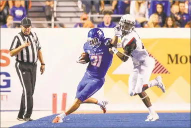  ?? Loren Orr / Getty Images ?? UConn’s Jeremy Lucien attempts to tackle Boise State’s Skyler Seibold in the Huskies’ 62-7 loss on Sept. 8.