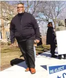  ?? KEVIN TANAKA/FOR THE SUN TIMES ?? 29th Ward Ald. Chris Taliaferro leaves Dever School after voting on Tuesday.