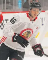  ?? VICTOR HILITSKI/FOR THE SUN-TIMES ?? Ian Mitchell, who has been part of the Hawks’ developmen­t camp, says he’s going to stay in college this upcoming season.