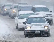  ?? DAVID ZALUBOWSKI/THE ASSOCIATED PRESS ?? When the roads become a snowy, slushy mess this winter, you will be glad you invested in snow tires designed specifical­ly to handle those difficult driving conditions.