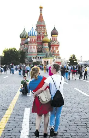  ?? FRANCK FIFE/AFP/GETTY IMAGES ?? Soccer fans from all over the world are in Russia cheering on their teams and taking photos in front of Saint Basil’s Cathedral in Red Square in Moscow during the World Cup.