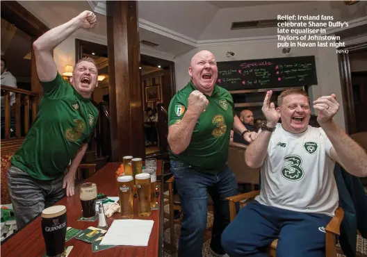  ?? INPHO ?? Relief: Ireland fans celebrate Shane Duffy’s late equaliser in Taylors of Johnstown pub in Navan last night