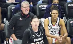  ?? David Butler II / Associated Press ?? Connecticu­t head coach Geno Auriemma shouts from the sideline during his record-tying effort on Satiurday.