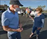  ?? Dan Watson/The Signal ?? Bob Colletta is surprised for his 88th birthday by his wife, Mary, as well as other family and neighbors in the parking lot of The Plaza at Golden Valley on Saturday.