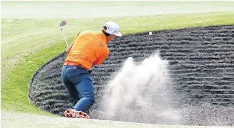  ?? AP PHOTO ?? Rickie Fowler plays out of a bunker on the sixth green during the final round of the British Open on Sunday. Fowler closed out the tournament with a 5-under 67.