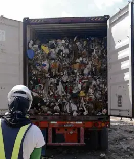  ?? —PHOTO COURTESYOF­MCWMC ?? STINKY IMPORTS Loads of trash packed in freight containers shipped from Canada are unloaded at Metro Clark Waste Management Corp. in Capas, Tarlac province, in this July 2015 file photo.