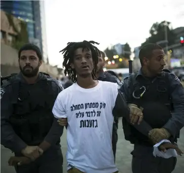  ??  ?? ISRAEL POLICE detain a protester during a 2015 anti-racism demonstrat­ion in Tel Aviv.