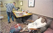  ?? JULIE JOCSAK THE ST. CATHARINES STANDARD ?? Rene Bergeron lays out artifacts he has collected about and from the Titanic, including a deck chair from the vessel and a life-vest from the movie Titanic, which will be displayed in the Titanic museum to be built in Niagara Falls.