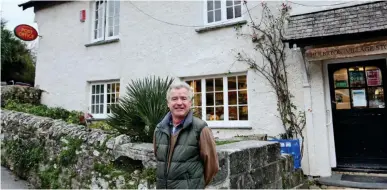  ??  ?? Three steps backwards: Mark Sims at his local Post Office