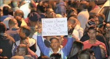  ??  ?? Community members protest outside the Chatsworth police station after the death of 9-year-old Sadia Sukhraj.