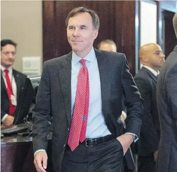  ?? ANDREW VAUGHAN / THE CANADIAN PRESS ?? Finance Minister Bill Morneau heads to the morning session as the Liberal cabinet meets in St. John’s, N.L. on Wednesday. His proposed tax changes have been a hot topic of discussion.
