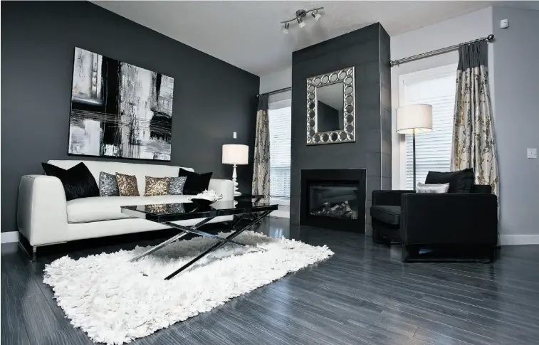  ?? PHOTOS: Supplied ?? Subdued, sophistica­ted charcoal walls play off the grey tones of the hardwood flooring in this Daytona show home. Daytona Homes is one of the builders featured in the community of Crystallin­a Nera.