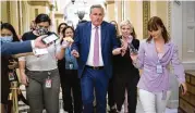  ?? SCOTT APPLEWHITE / ASSOCIATED PRESS ?? House Minority Leader Kevin Mccarthy, R-calif., heads to his office hounded by reporters after being issued a subpoena Friday.