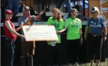  ??  ?? Sly Fox Brewing Company presented Schuylkill River Greenways National Heritage Area with a donation of $5,630 to go toward the Schuylkill River Trail during Saturday’s music festival at the brewery. Shown from left to right: Sly Fox Brewery manager Sarah Jagiela, Sly Fox Brewery sales manager Corey Reid, Schuylkill River Greenways National Heritage Area Executive Director Elaine Paul Schaefer, and Schuylkill River Greenways board members Wendi Wheeler and Edie Shean-Hammond.