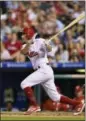  ?? DERIK HAMILTON — THE ASSOCIATED PRESS ?? The Phillies’ Ty Kelly watches his RBI double off Boston’s Chris Sale during the eighth inning Thursday in Philadelph­ia. Kelly got the start Friday night against Arizona after his clutch hit against the Red Sox.