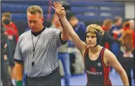  ?? Associated Press ?? Transgende­r wrestler: Euless Trinity's Mack Beggs is announced as the winner of a semifinal match after Beggs pinned Grand Prairie's Kailyn Clay.