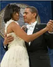  ?? Saul Loeb/AFP/Getty Images ?? President Barack Obama and first lady Michelle Obama dance at the Southern Regional Inaugural Ball in 2009.