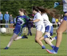  ??  ?? Roisin O’Reilly of AGB takes aim as Kate Hennessy and Jess Lyons close in.