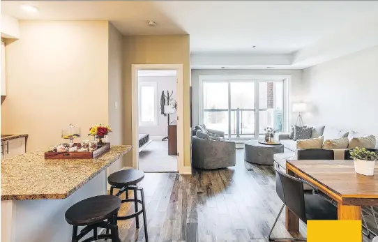  ??  ?? Above: Each unit features gorgeous engineered hardwood floors and an open-concept floor plan. Below: Some units have flexible spaces that can be used as dining rooms, dens or offices.