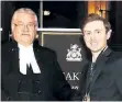  ?? SUPPLIED PHOTO ?? Adam Shoalts receives the Speaker's Book Award from Ontario legislatur­e Speaker Dave Levac.