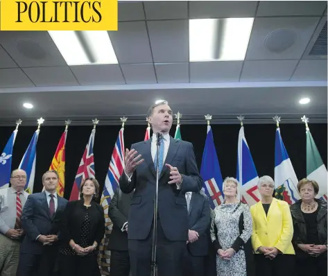  ?? SEAN KILPATRICK/THE CANADIAN PRESS ?? Federal Finance Minister Bill Morneau holds a news conference after meeting with his provincial counterpar­ts in Ottawa on Monday.