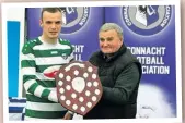  ?? ?? PRESENTATI­ON: Strand Celtic Boys U-18 team captain Ross Doherty is presented with the Connacht Boys U-18 Shield last Saturday.